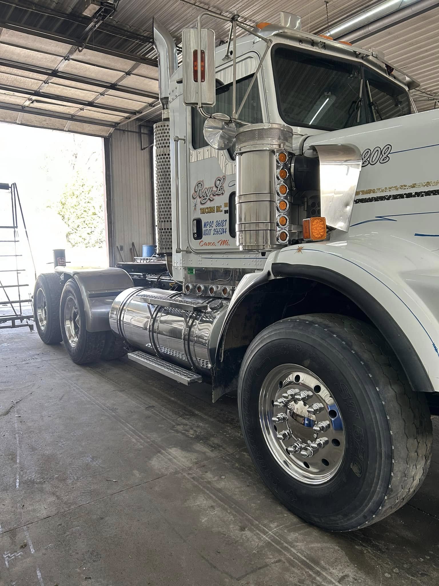Roy L. Trucking truck inside the shop