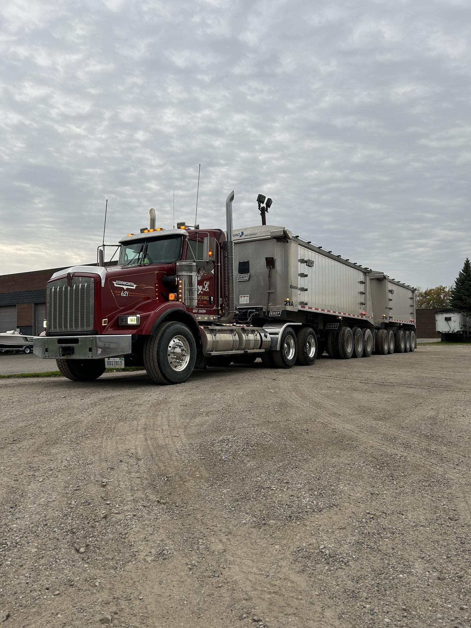 Roy L. Trucking truck parked in the yard